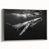 Framed wall art featuring a striking blue whale design on textured canvas, elegantly displayed in a sleek silver frame, perfect for marine life enthusiasts.