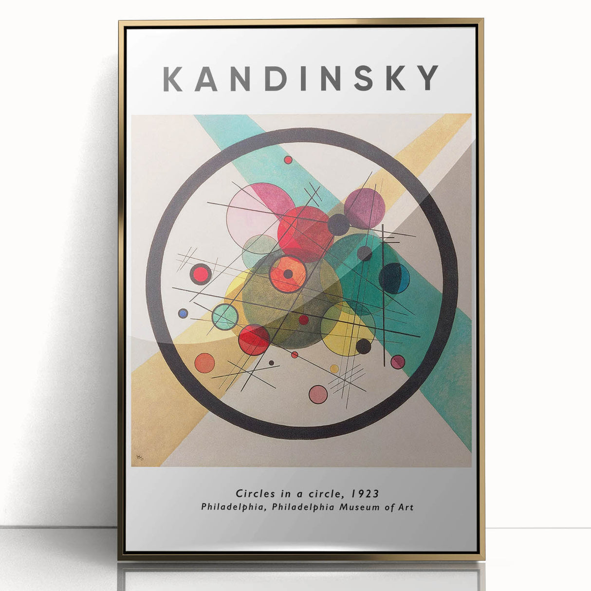 Mid-century modernist art featuring abstract shapes in vibrant colors on a gold-framed acrylic.