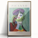Mid-century modernist art print of abstract shapes in neutral tones on a gold-framed acrylic.