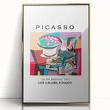 Mid-century modernist art print featuring abstract Picasso design in gold and black, framed in acrylic.