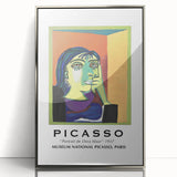 Mid-century modernist art featuring abstract shapes in bold colors on a silver-framed acrylic print.