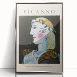 Mid-century modernist art depicting abstract shapes in muted tones on a silver-framed acrylic print.