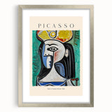 Textured abstract art print in a silver frame with mat, featuring swirling blue and gray tones, ideal for bedroom art.