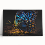 Black and white photo of a bird perched on a branch, printed on large stretched canvas.