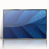 Mid-century modernist art featuring a close-up floral design in vibrant colors on a silver-framed acrylic print.