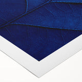 Art deco poster featuring close-up floral design in pastel shades on rolled canvas.