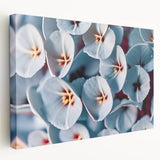 Close-up of floral imagery in soft pastel shades on a large stretched canvas, ideal for kitchen wall art.