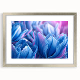 Textured art print featuring abstract floral designs in soft pastel colors on a framed silver mat, ideal for bedroom decor.