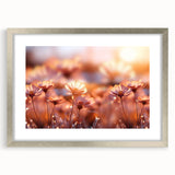 Textured art depicting abstract floral designs in soft pastel shades on a framed silver mat, ideal for bedroom art.