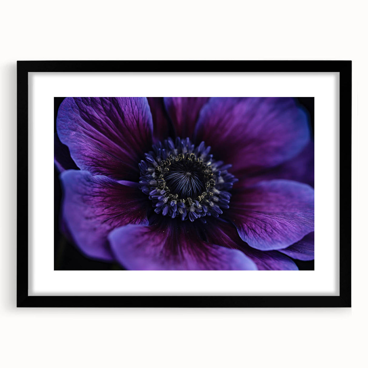 Abstract art print featuring vibrant, colorful florals on a textured canvas, framed in black, suitable for living room decor.