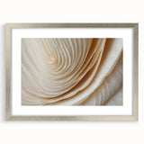 Textured art of abstract florals in muted earth tones on a framed silver mat, ideal for bedroom wall decor.