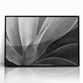 Large abstract wall art featuring vibrant floral patterns in a mid-century modernist style, framed in black acrylic.