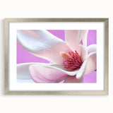 Textured art depicting abstract floral designs in soft pastel shades on a framed silver mat, ideal for bedroom ambiance.