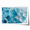 Close-up image of frost patterns on ice in muted blue tones, rolled print.