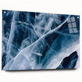Frost pattern close-up on large acrylic glass, featuring cool blue and white tones.