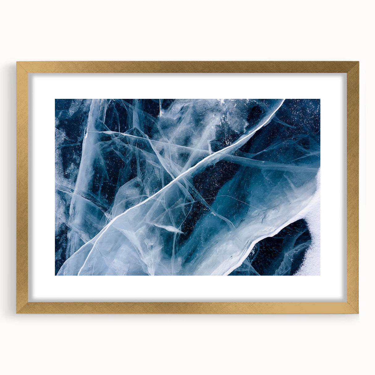 Textured art depicting abstract frost designs in muted blue and white tones, framed in gold, ideal for bedroom wall decor.