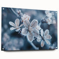 Close-up image of frost patterns on acrylic glass, featuring a monochrome blue palette.