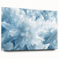 Close-up of frost pattern on acrylic glass, featuring intricate ice designs in cool blue and white.