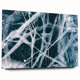 Large abstract wall art depicting frost patterns in muted blue and white tones on acrylic glass.