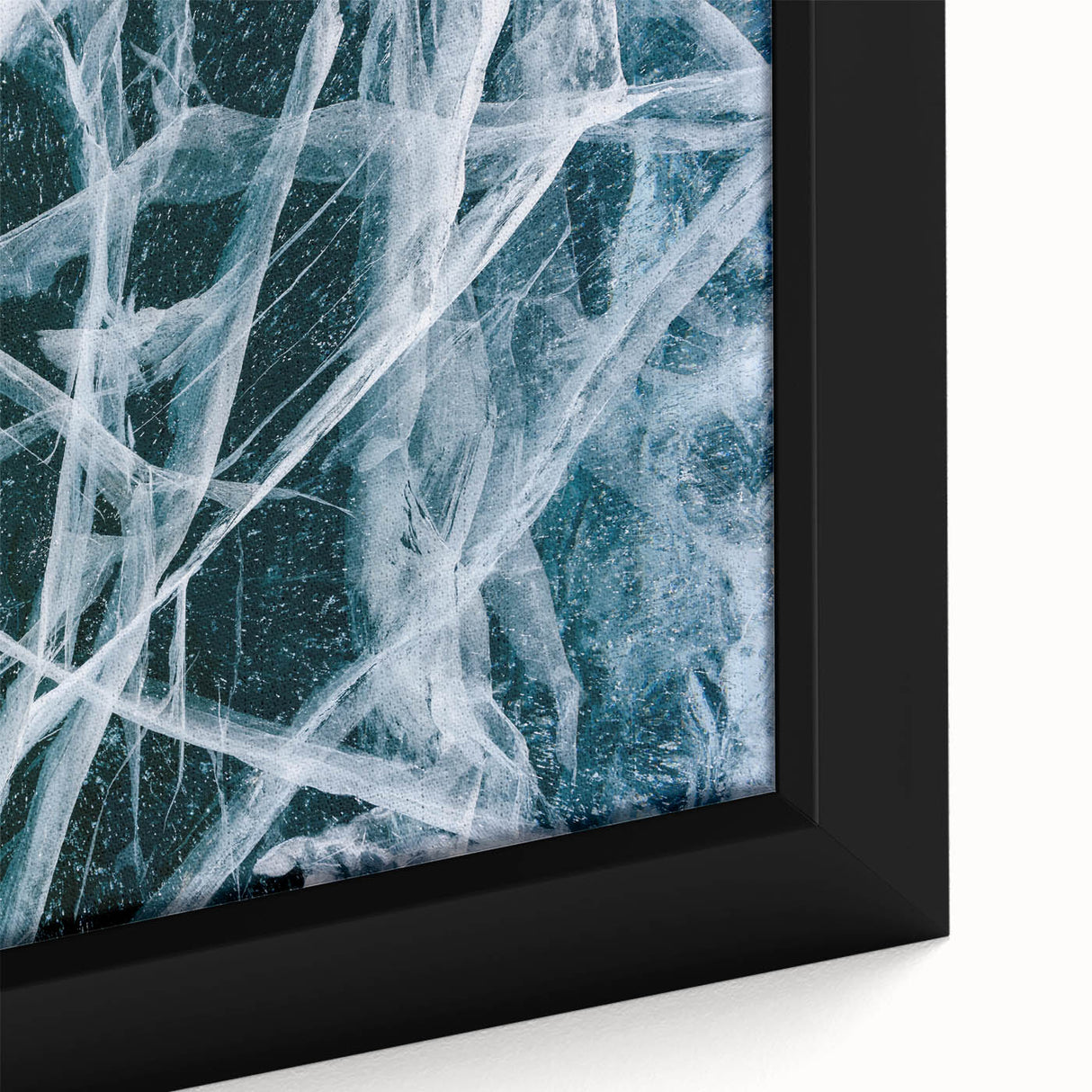 Close-up of textured black wall art featuring a frost-like design on a framed canvas, suitable for living room decor.