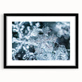 Extra large abstract art print depicting a frost design in vibrant blue and white tones on a black framed canvas.