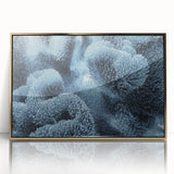 Mid-century modernist art depicting a frost design in muted blue and white tones on a framed acrylic panel.