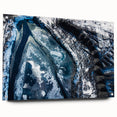 Close-up image of frost patterns on acrylic glass, featuring a monochrome blue palette.