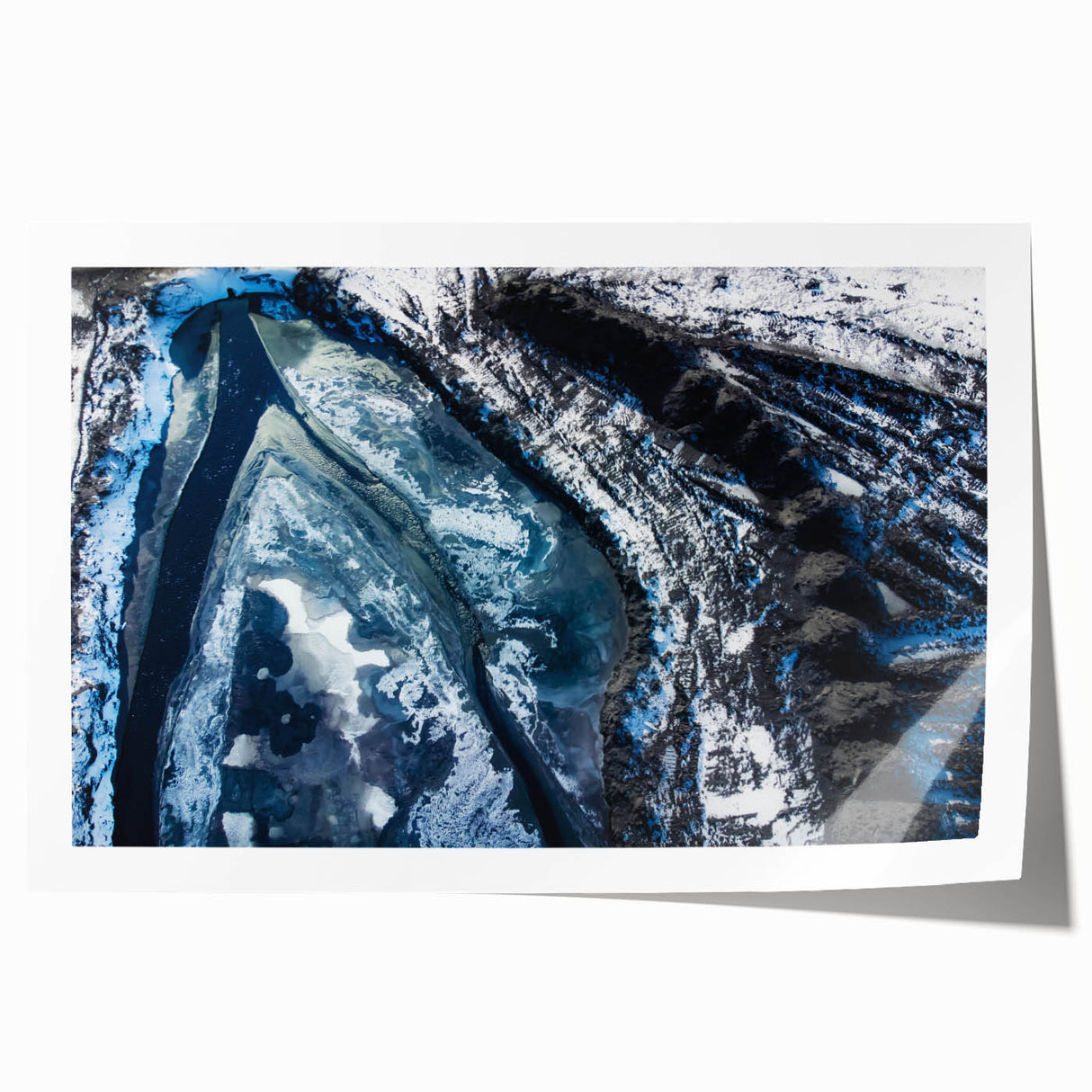 Close-up of frost patterns on ice in muted blue and white tones, rolled print.
