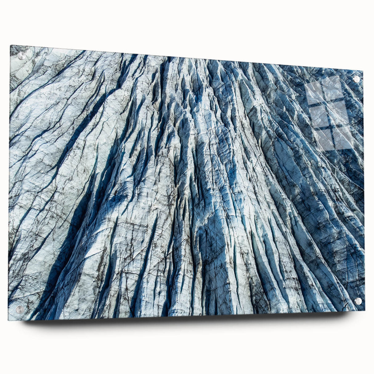 Close-up of frost pattern on acrylic glass, in muted blue and white tones, suitable for bedroom or dining room decor.