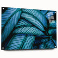 Close-up of leaves in green and yellow hues on acrylic glass, suitable for dining room decor.