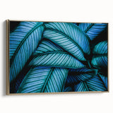 Framed canvas featuring close-up of leaves in muted green and gold, ideal for bedroom wall art.