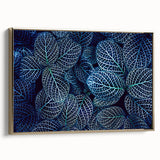 Close-up of leaves in muted green and black, vintage poster style framed canvas, suitable as wall art for bedroom.