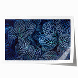 Close-up of green leaves on a rolled canvas print with vibrant green tones, ideal for dining room wall art.