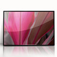 Large abstract wall art featuring close-up leaves in muted green and brown shades, presented in a black acrylic frame.