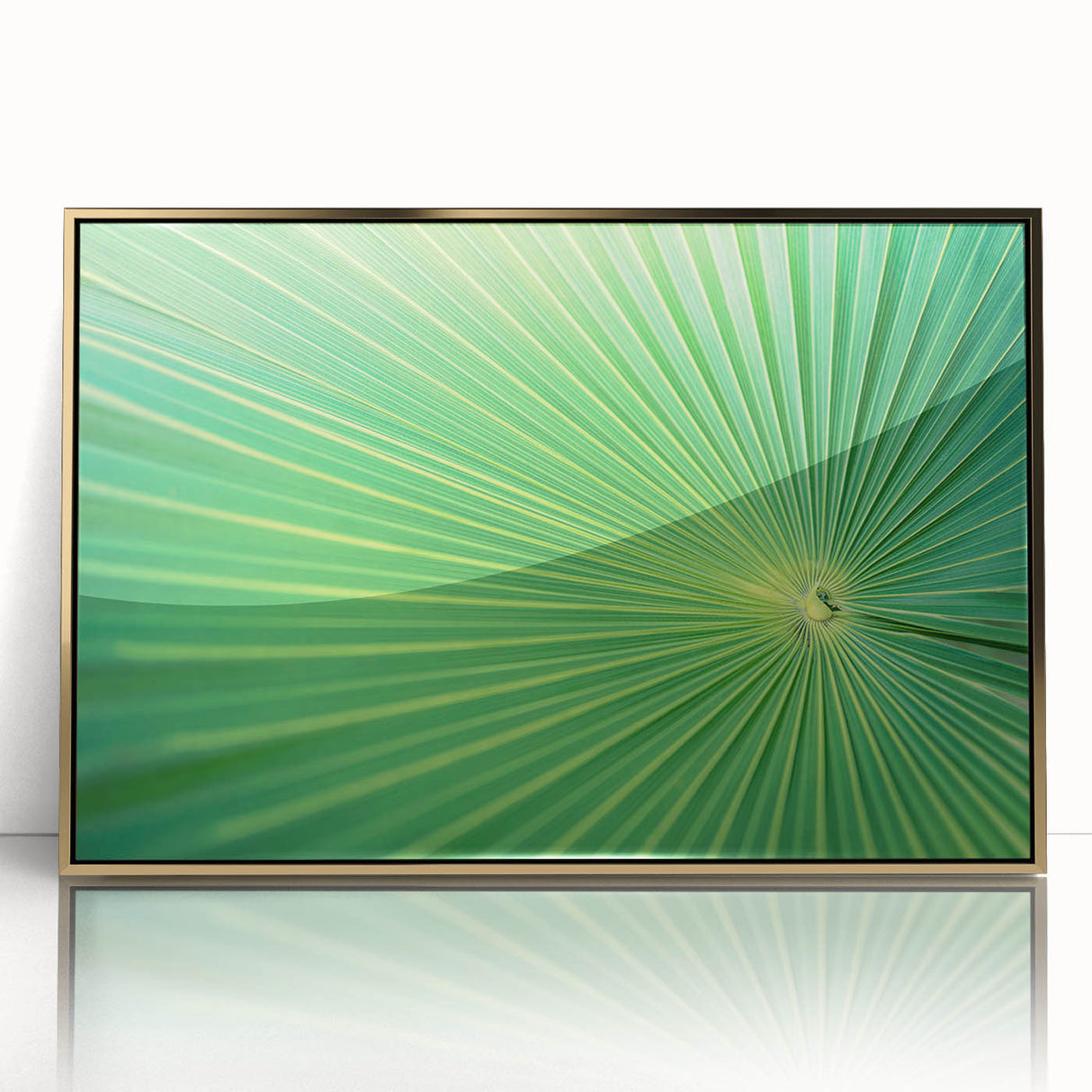 Close-up of leaves in muted green tones on a large acrylic print, framed in gold, suited for modern nursery decor.