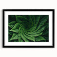 Extra large abstract art print featuring a close-up of leaves in vibrant colors, textured on a black framed canvas.