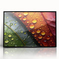 Large abstract wall art featuring close-ups of leaves in green and yellow tones, framed in black acrylic.