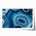 Close-up floral art featuring soft pink and white blossoms on a rolled canvas, ideal for dining room wall decor.