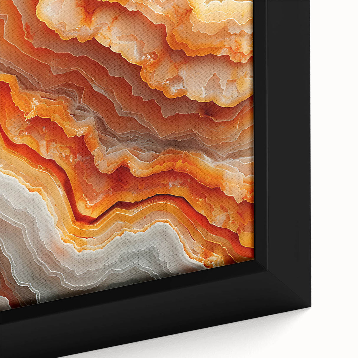 Close-up of textured black wall art featuring colorful natural elements on a framed canvas, ideal for living room decor.