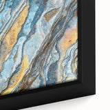 Close-up black wall art featuring textured, colorful natural elements on a framed canvas, ideal for living room decor.