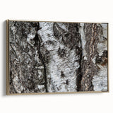 Framed canvas featuring a close-up view of tree trunks in muted gold and black tones, ideal for bedroom wall decor.