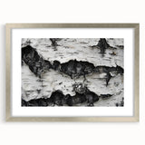 Textured art depicting close-up abstract tree designs in muted earth tones on a silver-framed canvas.