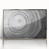 Mid-century modernist art depicting close-up trees, framed in silver acrylic, in muted green and brown tones.
