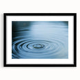 Extra large abstract art print featuring a textured, colorful water design on a black framed canvas.