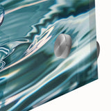 Large abstract wall art on acrylic glass featuring close-up water ripples in blue and gray tones.