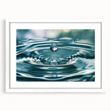 Abstract art print featuring swirling blue and white patterns on a framed white mat.
