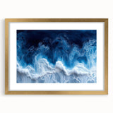 Abstract art print featuring textured swirls in muted earth tones, framed in gold.