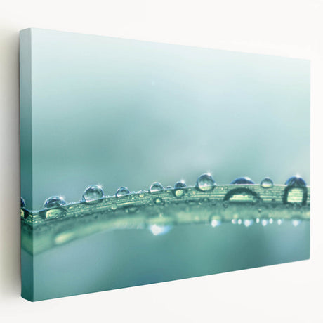 Close-up water droplet photography on a stretched canvas, featuring cool blue and white tones, ideal for kitchen wall art.