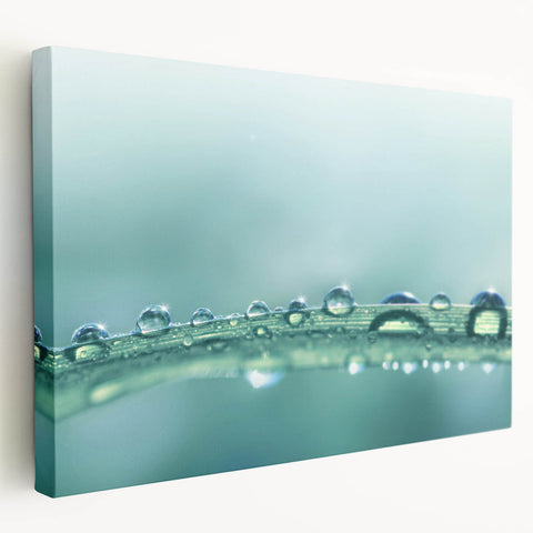 Close-up water droplet photography on a stretched canvas, featuring cool blue and white tones, ideal for kitchen wall art.