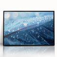 Large abstract wall art depicting swirling water patterns in muted blue and gray tones, framed in black acrylic.